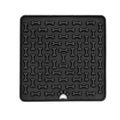 Dog enjoying silicone lick mat with treats